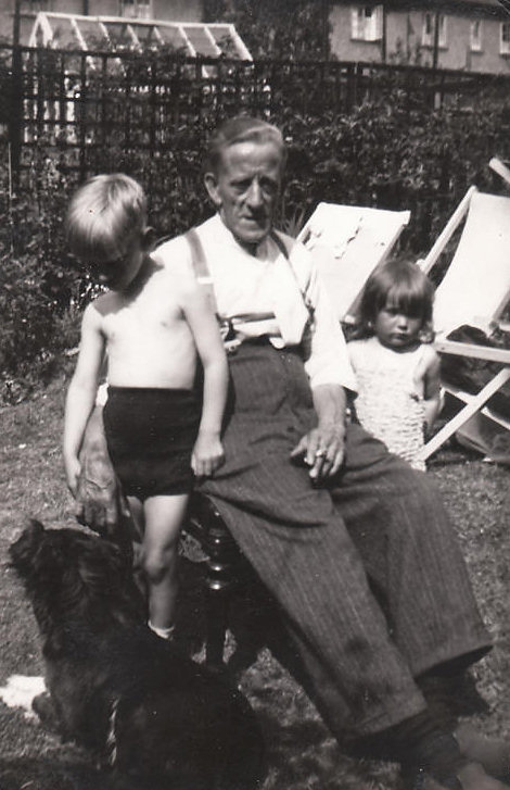 William George Moore in his back garden in Tooting with his grandson John and Grand daughter Hazel