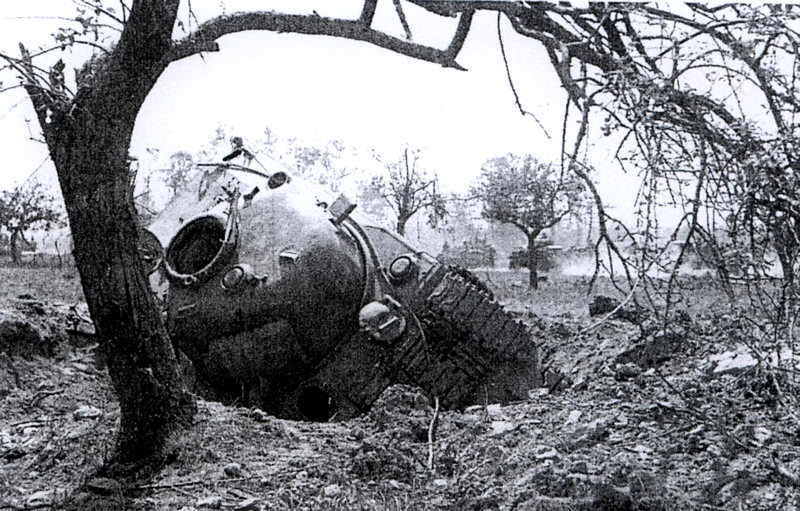 A Sherman Tank stuck in a bomb or artillery shell crater